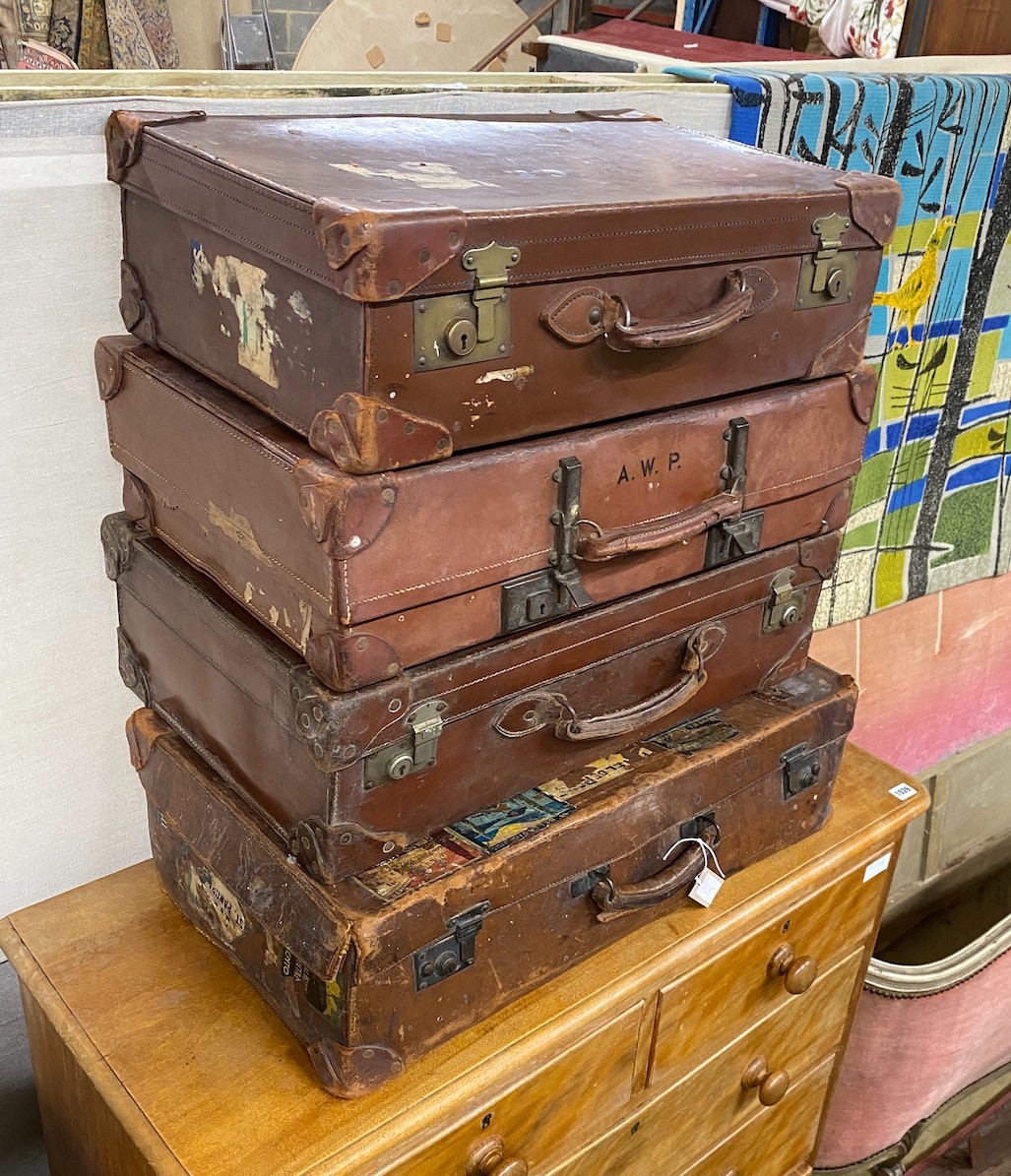 Four vintage suitcases, largest 70 x 40cm